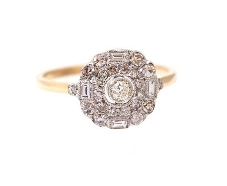 A diamond and 14ct gold cluster ring, the central rub-over set round brilliant-cut diamond with a halo of pave set round bril