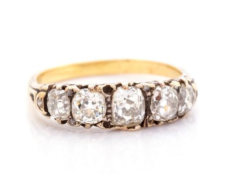 A Victorian diamond ring, comprising five graduated oval/cushion old-cut diamonds, with a estimated total diamond weight of a