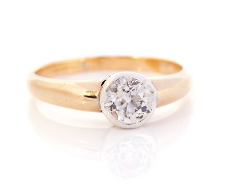 A diamond solitaire yellow gold ring, the round old cut diamond rub over set weighing approx 1 carat, assessed colour H, asse