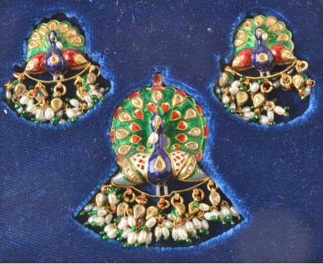 An Indian Jaiphur enamel, diamond and pearl set peacock pendant with matching earrings, boxed. 