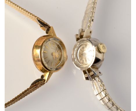 A ladies Rolex Orchid, white metal cased wristwatch on plated strap and a Tissot ladies wristwatch.

 Condition Report: Winds