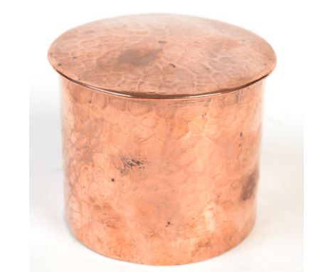 A Newlyn copper cylindrical plain hammered tea caddy, impressed mark. 