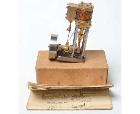 A Stuart Progress model steam engine with vertical single cylinder, together with an instruction booklet. Height 11cm. 