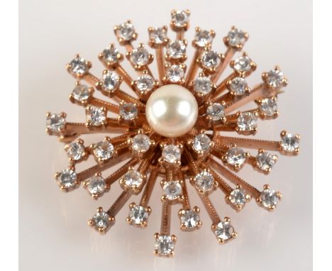 A good diamond and pearl starburst brooch.