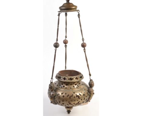 An Eastern pendant brass lamp with three caryatid hanger mounts. Condition Report: reasonably good condition but has done man