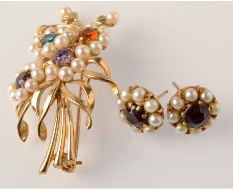 A 9ct. gold flower spray brooch and a pair of 9ct. gold pearl and garnet earrings.