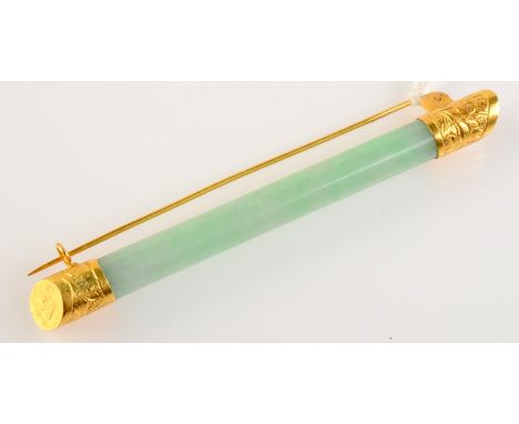 A Chinese high purity gold mounted jade brooch.