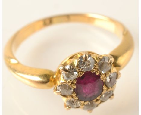 A ruby and diamond cluster ring.