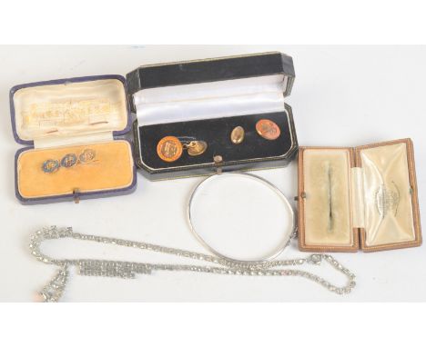 A Chinese gold good luck characters brooch in Sincere Co. Jewellers, Shanghai box, a pair of silver gilt 1935 silver jubilee 