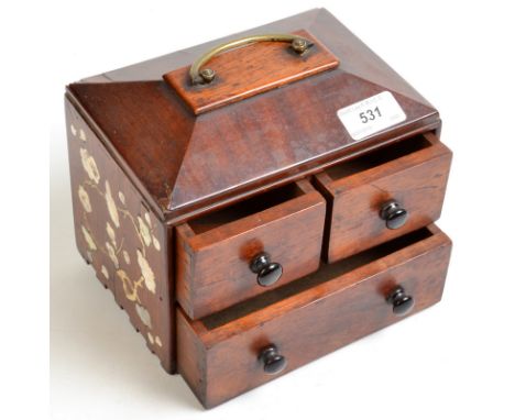 A miniature, three drawer chest with carrying handle, the sides inlaid with bone and mother of pearl. 