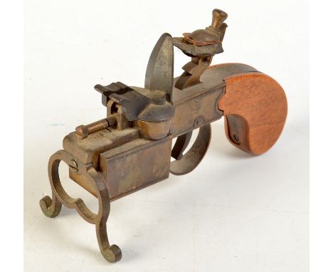 A Dunhill flintlock table lighter.