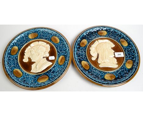 A pair of Austrian majolica portrait plaques.