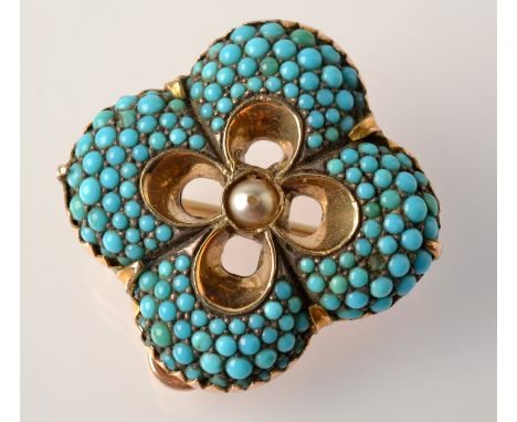 A Victorian quatrefoil gold pendant/brooch pave set with turquoise about a central pearl. 
 Condition Report: One stone chipp