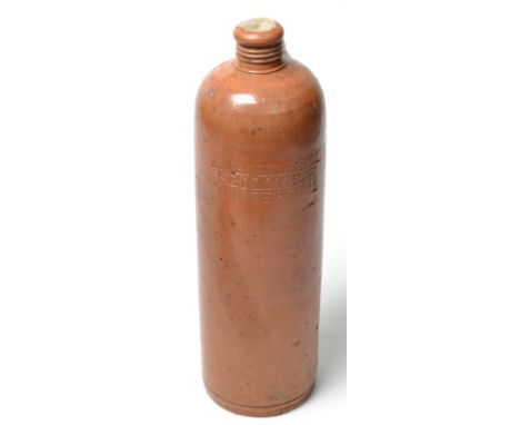 Ceramic gin bottle marked 'Erven Lucas Bols Het Lootsje Amsterdam', the bottle full of liquid and sealed with wax.