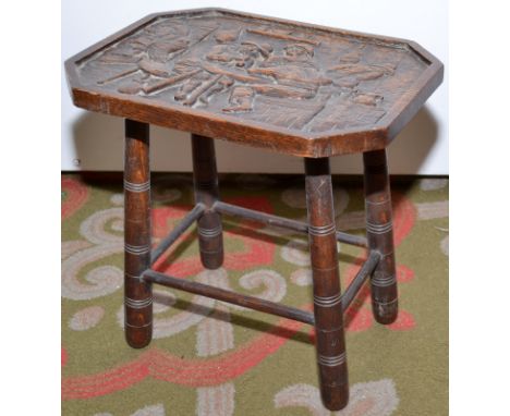 A carved stool.