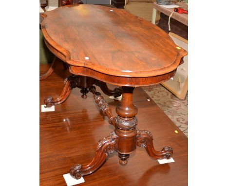 A good Victorian walnut veneered, oval sofa table on twin pedestals with vine carved cabriole legs. 122 x 67cm.