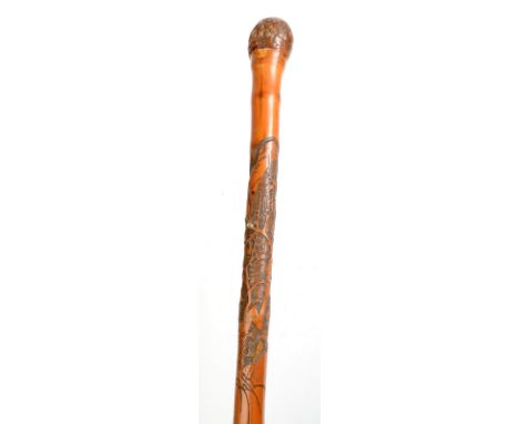 A Chinese carved bamboo walking stick. 