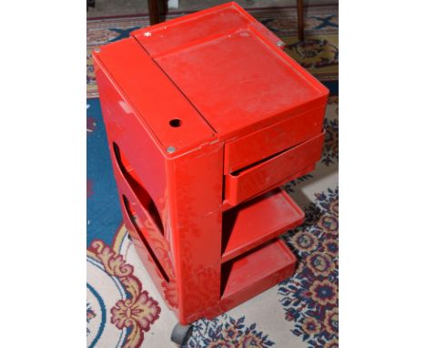 A red Joe Colombo office three tier caddy, height 73.5cm. Condition Report: There is damage on the top (burn/melted) about 10