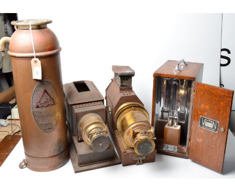 Two magic lanterns, a copper fire extinguisher and a 1930's vi-tan lamp. 
