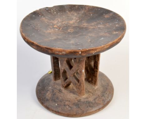 An African tribal pierced wood stool. Diameter 23.5cm, height 19cm. 