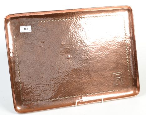 A plain rectangular Newlyn copper tray. With the initial 'R', made for the Penzance scout master, Jack Reynolds. Impressed ma