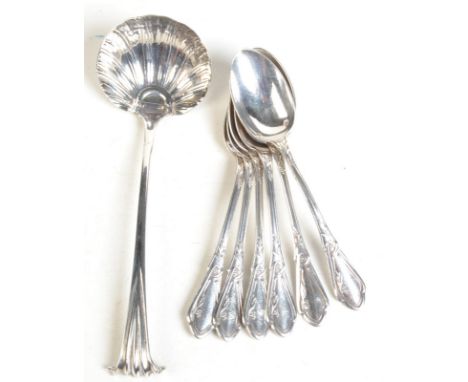 A set of six continental silver teaspoons in Art Nouveau style, together with an 18th century ladle, restoration. Net weight 