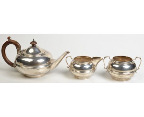 A George V three piece tea service, each circular with ribbed band, by Charles Boyton & Son, London, 1922, 13.5ozs.