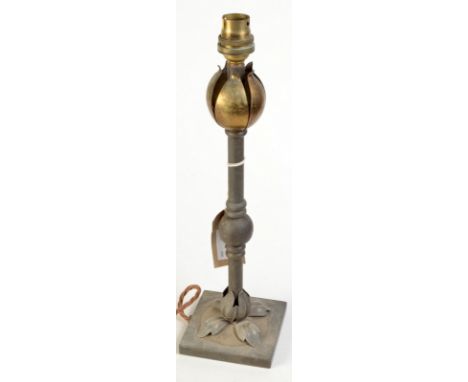 An Arts and Crafts brass table lamp.