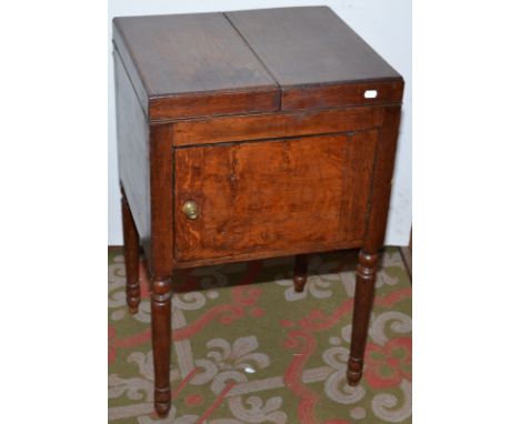 An oak commode with double hinged top, width 50cm.  Condition Report: Good condition for age, surface marks.
