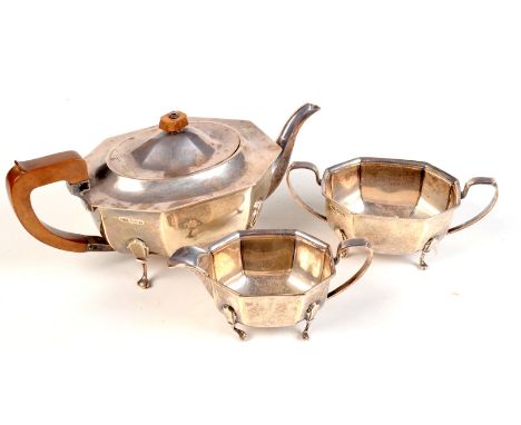An Art Deco influence silver three piece tea service octofoil design resting on four cabriole legs, by Viner's Ltd., Sheffiel