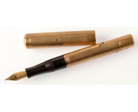 A gentleman's engine turned, 9ct. gold fountain pen with Watermark Ideal patent nib, hallmarked London 1926. 
