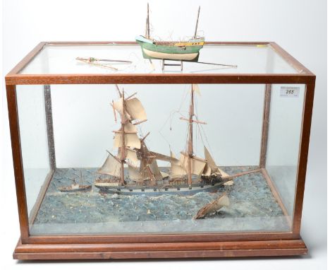 A scale diorama with a clipper, a pilot boat and a steam tug, in glazed mahogany case. width 58.5cm, height 38.5cm, depth 40c