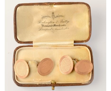 A pair of 9ct. gold engine turned cufflinks.  Condition Report: 9.8gms.
