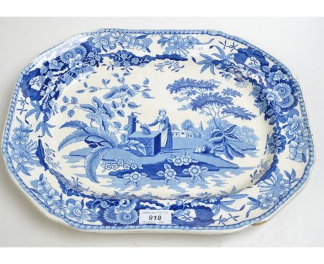 A John Heath blue and white print decorated meat plate showing a woman at a well, impressed factory mark, 41.5cm. Condition R