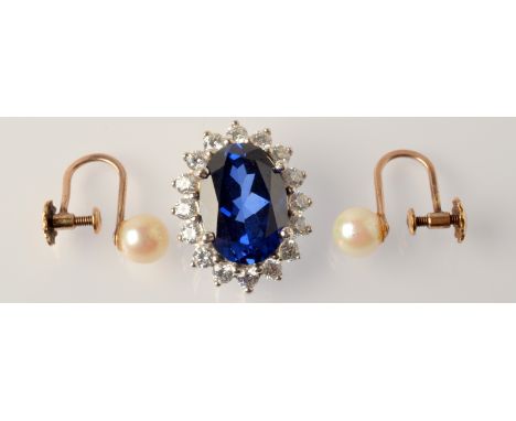 A Swarovski pendant and a pair of pearl earrings.