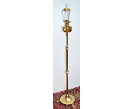 An Arts & Crafts brass standard lamp with Messenger's no.2 burner. Condition Report: good condition, commensurate with age
