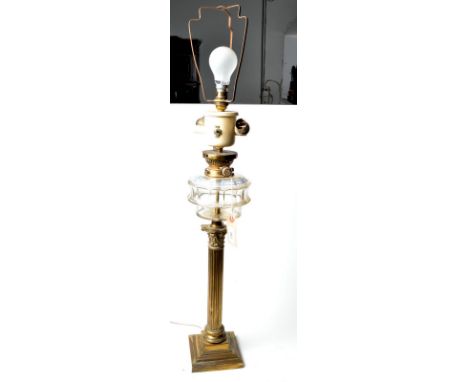 An oil lamp converted to electricity.  Condition Report: Most of burner removed. Fount chipped and cracked, old electrics.