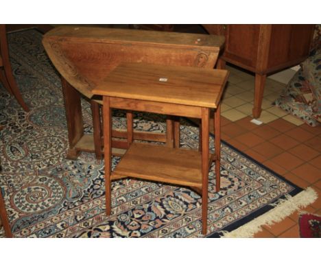 A LIGHT OAK GATE LEG TABLE, in Arts & Crafts style having scrolled carved border, approximately 93.5cm diameter, together wit