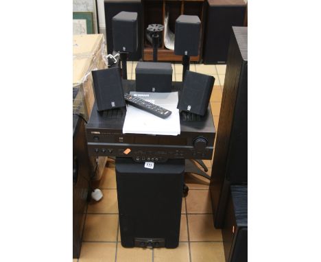 A YAMAHA SURROUND SOUND SYSTEM, including a RXV520 AV receiver, a YST SW80 Sub Woofer, four NX22OP satellite speakers and an 