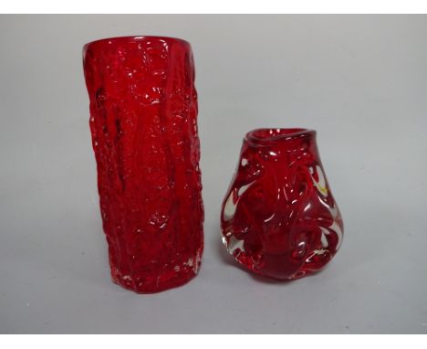TWO RUBY ART GLASS VASES, one of cylindrical form having bark effect, approximately 23.5cm high, one of squat tapering knobbl