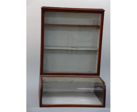 AN ASHTON & PARSONS HOMEOPATHICS CABINET, having curved glass display section to base with glazed three shelf section over, h