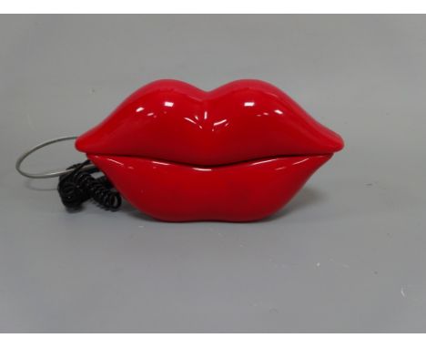 A RETRO TELEPHONE, 'Lips' Telemania, model No. Lips, Ren No.1.3, FCC Reg No.FBJCHN - 74626 -TE-E Serial No.G3595L, approximat