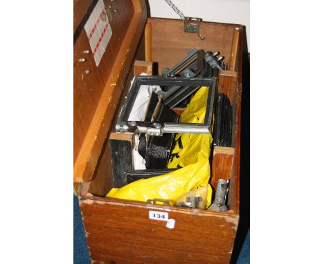 A WOODEN BOX CONTAINING FILM PLATES, Bellows, Hoods, frames and a film 'Bad' by Graflex