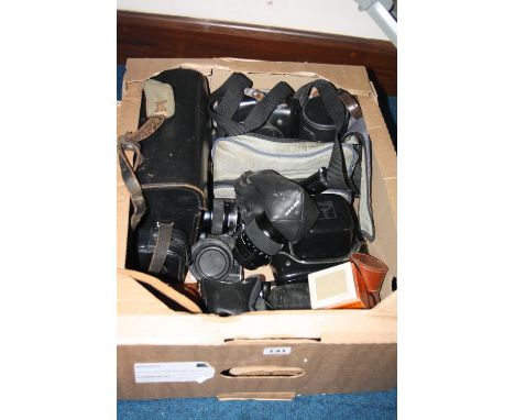 A BOX OF CAMERAS AND LENSES, including a Praktica Super TL with Tessar 50mm 1:2.8, a Praktica LB with tessar 50m 1:2.8, a Ric