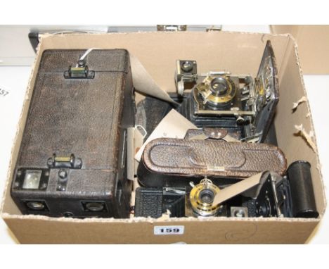A BOX OF J.T. CHAPMAN AND KODAK CAMERAS, to include 'The British' box camera, a No.A-127 Vest Pocket, a No.1 folding in brown