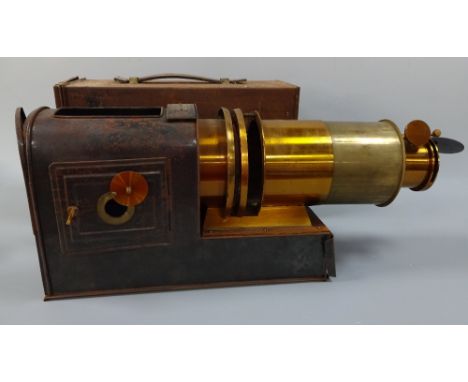 A LATE 19TH CENTURY BRASS AND TIN PLATE MAGIC LANTERN, label 'Patent No.2459' and 7 inch Rd.No.230577 to cap, approximately 5