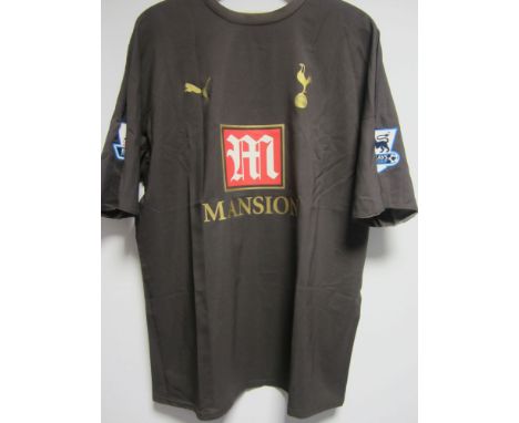 MIDO / SPURS / SHIRT    Short sleeve Puma match worn away shirt, chocolate brown with gold trimmings and lettering, Tottenham