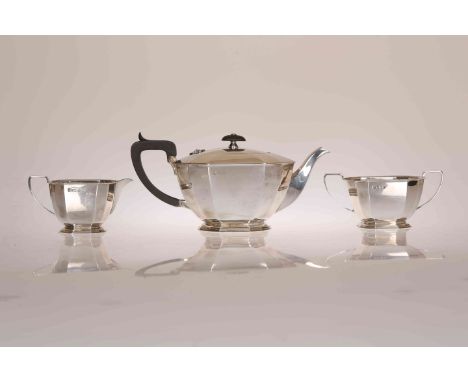 AN ART DECO STYLE SILVER THREE PIECE TEA SERVICE, Cooper Brothers & Sons, Sheffield 1962, comprising teapot, cream jug and tw