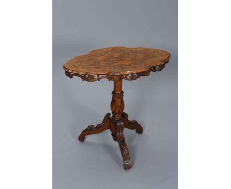 A BLACK FOREST INLAID WALNUT TRIPOD TABLE, 19TH CENTURY, the shaped oval top profusely inlaid with scrolling foliage and deer