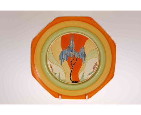 "WINDBELLS", A CLARICE CLIFF PLATE, c. 1933, octagonal, painted with a sinuous tree with lenticular foliage, black printed Ne